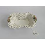 A Spanish woven porcelain basket, the side handles decorated with raised flowers.