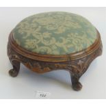 A Victorian walnut cabriole leg circular footstool.