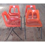 A set of four circa 1970's Plasson of Italy orange plastic and tubular design metal dining chairs.