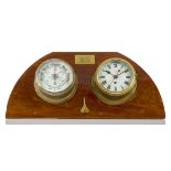 A BULKHEAD CLOCK AND BAROMETER SET FROM H.M.S. EXETER