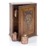 A SMOKER’S CABINET MADE FROM FOUDROYANT OAK BY GOODALL, LAMB & HEIGHWAY, CIRCA 1898