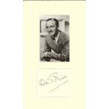 David Niven signature piece mounted below black and white photo. Approx overall size 12x7. 1 March