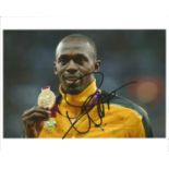 Usain Bolt Athletics Signed 12 x 8 inch sport photo. Good Condition. All autographs are genuine hand