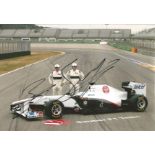 Formula 1 Sauber Motor Racing 2011 team 12 x 8 photo of two drivers in with car in race overalls