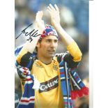 Carlos Cuellar Rangers Signed 10 x 8 inch football photo. Good Condition. All autographs are genuine