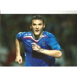 Lee McCulloh Rangers Signed 12 x 8 inch football photo. Good Condition. All autographs are genuine