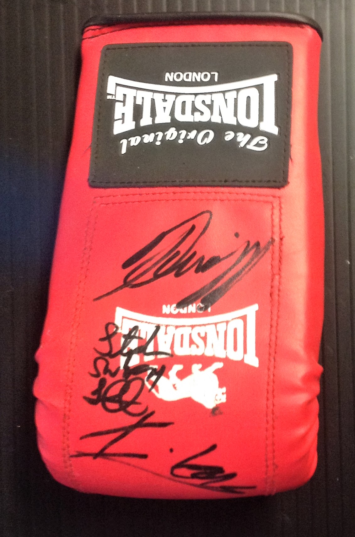 Boxing glove signed by Scott Quigg, Liam Smith & Isaac Lowe. Good Condition. All autographs are