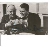 Space and Rocket pioneer Werner Von Braun signed 5 x 3 b/w photo sitting with a General looking at a