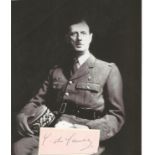 Charles De Gaulle signed clipped signature piece approx 3 x 1 inches with black and white magazine