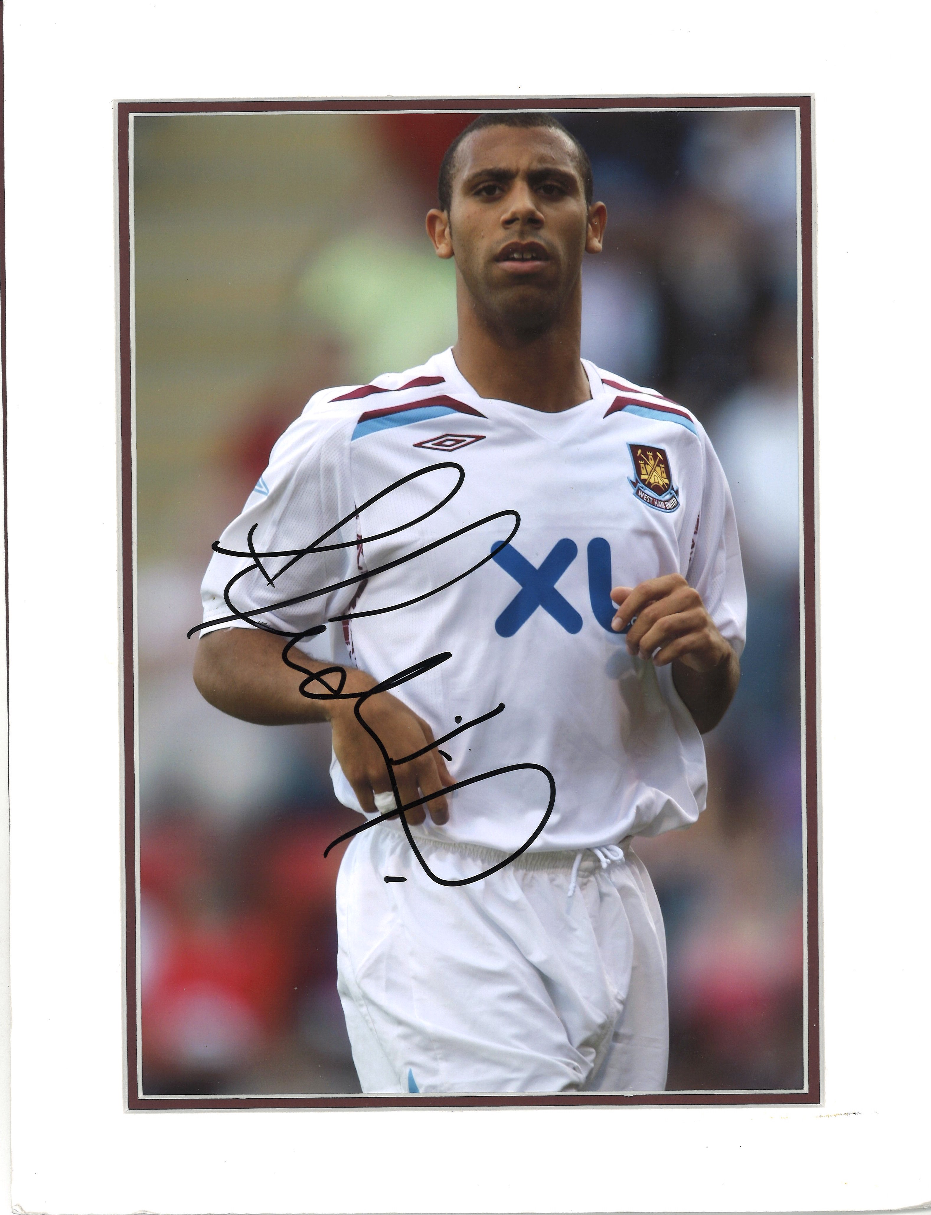 Football Anton Ferdinand signed 14x10 mounted colour photo pictured in action for West Ham United.