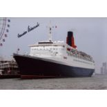 Cunard QE2 cruise ship 8x12 inch photo signed by Commodore R.W Warwick, the last ever captain of the