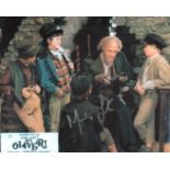 Oliver. 8x10 scene photo from the classic British musical Oliver, signed by lead role actor Mark