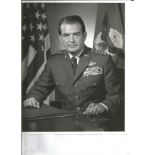 General David C Jones USAF signed 10 x 8 b/w photo seated in full uniform, dedicated to Herr