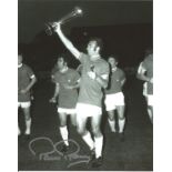 Paul Reaney signed 10x8 b/w football photo pictured celebrating with the Fairs Cup with his Leeds