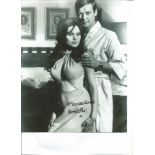 James Bond Madeline Smith signed 10 x 8 b/w photo standing with Roger Moore. Good Condition. All