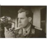 WW2 Luftwaffe ace Karl Ludwig Johanssen KC signed 5 x 3 inch b/w portrait photo in uniform. Good