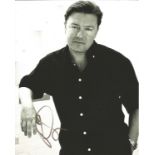Ricky Gervais signed 10x8 black and white half body portrait photo. Good Condition. All autographs