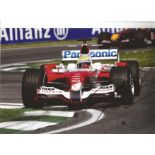 Ralf Schumacher signed 11x8 colour photo of him racing Toyota at Imola in 2005. Good Condition.