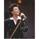 Paul Young signed 10x8 colour photo of the singer back in the 80's. Good Condition. All autographs