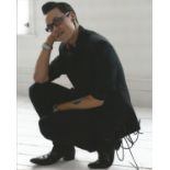 Gok Wan signed 10x8 full portrait colour photo kneeling down. Good Condition. All autographs are