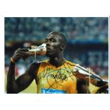 Athletics Usain Bolt 16x12 inch signed colour photo of the legendary Jamaican sprinter . Good