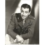 Robert Taylor signed 10 x 8 inch b/w photo in Army uniform. Good Condition. All autographs are