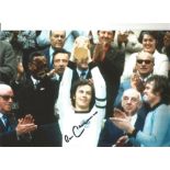 Football Franz Beckenbauer 12x8 inch signed colour photo pictured lifting the World Cup in 1974.