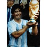 Football Diego Maradona signed 16x12 inch colour photo pictured during 1986 Mexico World Cup. Good