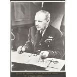 WW2 Arthur Bomber Harris signed 10 x 8 inch b/w portrait seated at his desk in WW2 in full
