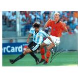 Football Dennis Bergkamp 16x12 inch signed colour photo pictured in action for Holland. Good