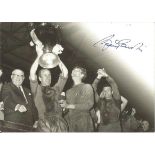 Sir Bobby Charlton signed 6 x 4 inch b/w photo holding the European Cup. Good Condition. All