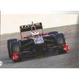 Formula 1 Vitaly Petrov Grand Prix racing driver signed Renault car in action photo. Comes with