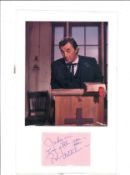 Robert Mitcham signature piece mounted below colour photo. Dedicated. He has signed it Bob