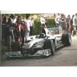 Formula 1 Nick Heidfeld Grand Prix racing driver signed Mercedes car in action photo. Comes with COA