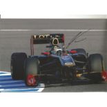 Formula 1 Nick Heidfeld Grand Prix racing driver signed Lotus Renault car in action photo. Comes