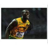 Usain Bolt Athletics Signed 10 x 8 inch sport photo. Good Condition. All autographs are genuine hand