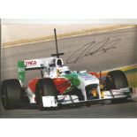 Formula 1 Paul Di Resta Grand Prix racing driver signed Force India car in action photo. Comes