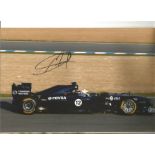Formula 1 Pastor Maldonado Grand Prix racing driver signed Williams car in action photo. Comes