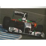 Formula 1 Adrian Sutil Grand Prix racing driver signed Force India car in action photo. Comes with