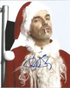Bad Santa Billy Bob Thornton signed superb 10x 8 colour photo in Santa outfit smoking a cigarette.