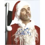 Bad Santa Billy Bob Thornton signed superb 10x 8 colour photo in Santa outfit smoking a cigarette.