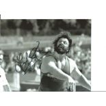 Athletics Geoff Capes 10x8 Signed B/W Photo Pictured In Shot Putt Action. Good Condition. All