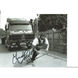 Athletics Geoff Capes 10x8 Signed Coloured Photo Pictured Pulling a Lorry. Good Condition. All