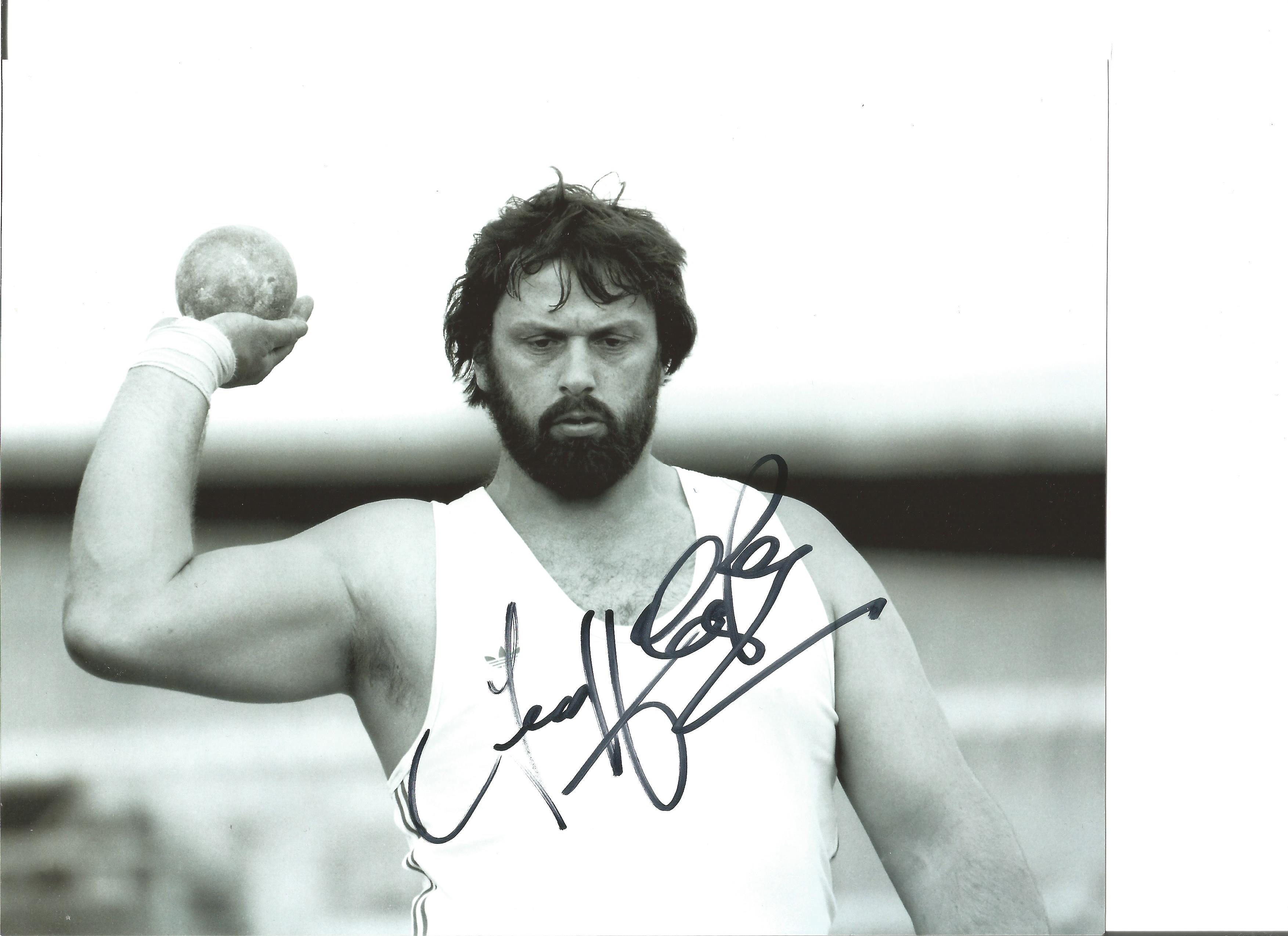 Athletics Geoff Capes 10x8 Signed B/W Photo Pictured In Shot Putt Action. Good Condition. All