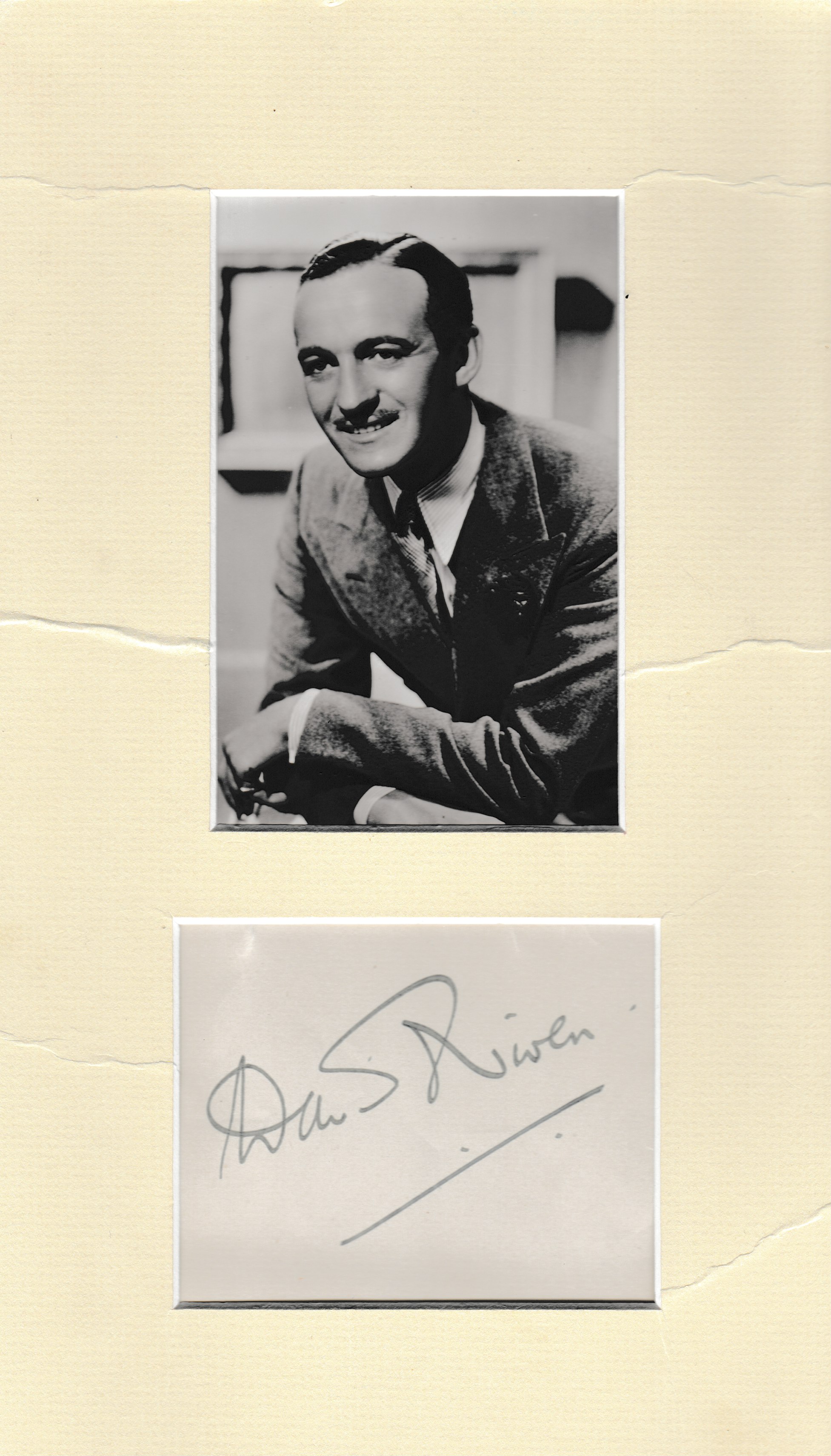 David Niven signed album page mounted with 6 x 4 unsigned b/w portrait photo. Good Condition. All