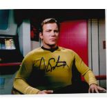 Star Trek William Shatner as Captain Kirk signed 10 x 8 inch colour photo sitting in Captains chair.