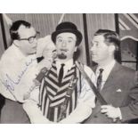 Eric Morecambe and Ernie Wise signed 8 x 6 inch music magazine photo with Aker Bilk. Good Condition.