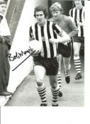 Bobby Moncur 10x8 Signed B/W Photo Pictured Leading Newcastle United Out. Good Condition. All