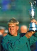 John Daly Signed 16 X 12 inch golf colour photo. Good Condition. All autographs are genuine hand