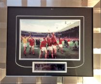 Bobby Charlton 17 X 20 professionally framed and mounted 1966 world cup winners signed colour photo.